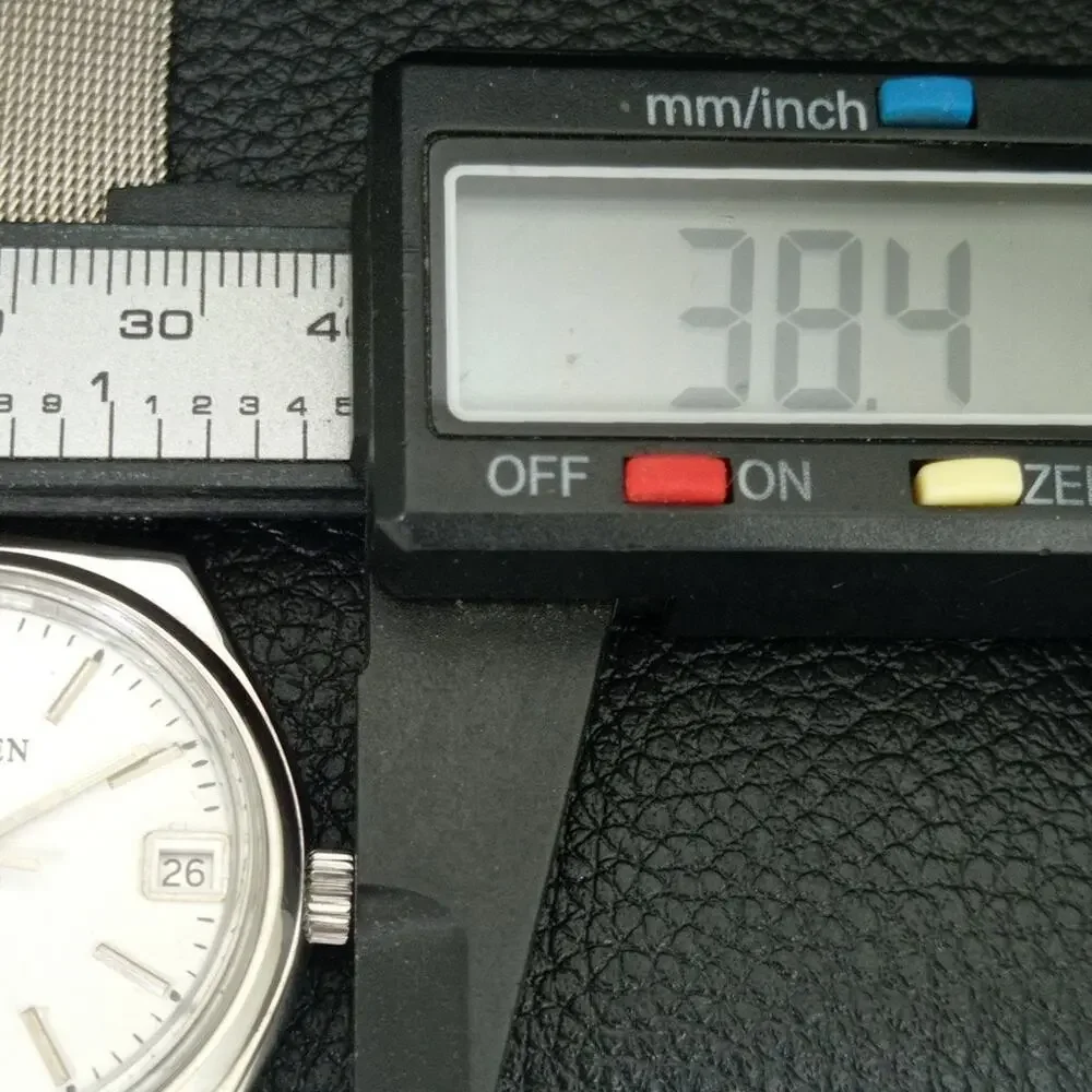 Vintage 1988 Citizen Manual Mens Silver Watch W/daydate & White accents